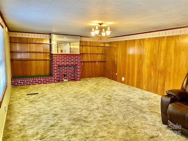 interior space featuring carpet floors, a chandelier, visible vents, and wooden walls