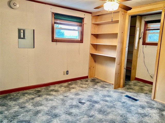 unfurnished bedroom with carpet floors, visible vents, and baseboards