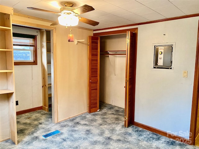 unfurnished bedroom with a closet, visible vents, carpet flooring, ceiling fan, and baseboards