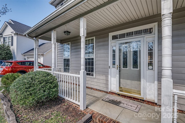 property entrance with covered porch