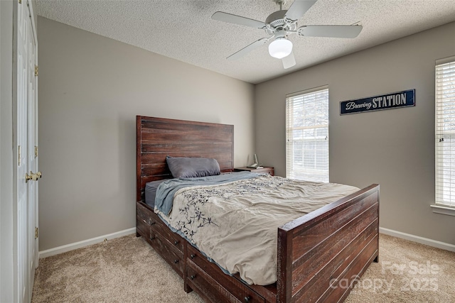 bedroom featuring baseboards, multiple windows, and light colored carpet