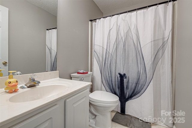 bathroom with toilet, a textured ceiling, and vanity