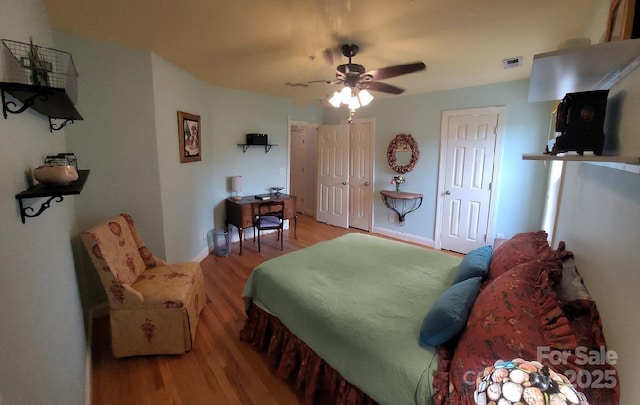 205 Kaitlyn Ln, Kings Mountain, NC 28086 - bedroom with wood finished floors, two closets, a ceiling fan, and baseboards