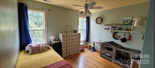 205 Kaitlyn Ln, Kings Mountain, NC 28086 - bedroom featuring wood finished floors, a ceiling fan, and radiator