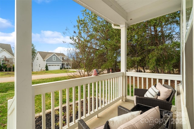 balcony featuring a porch and a residential view