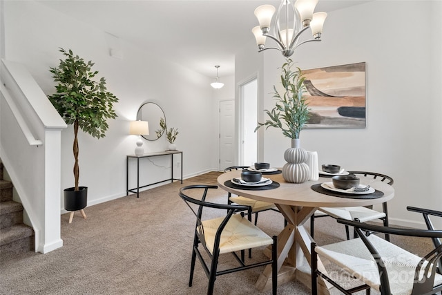 dining space with baseboards, stairway, a chandelier, and light colored carpet