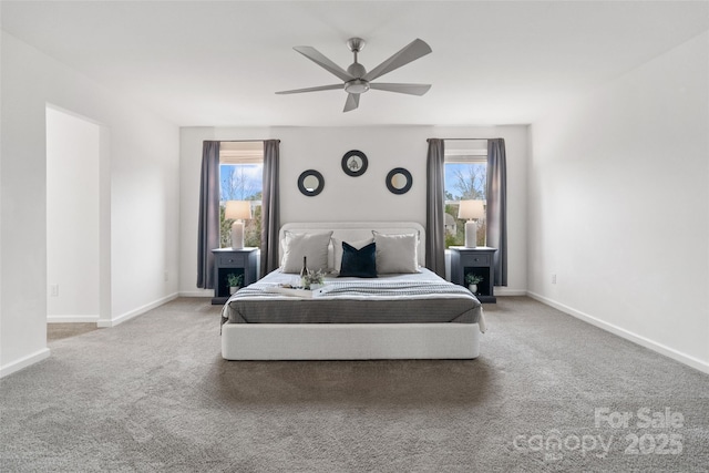 carpeted bedroom with a ceiling fan and baseboards