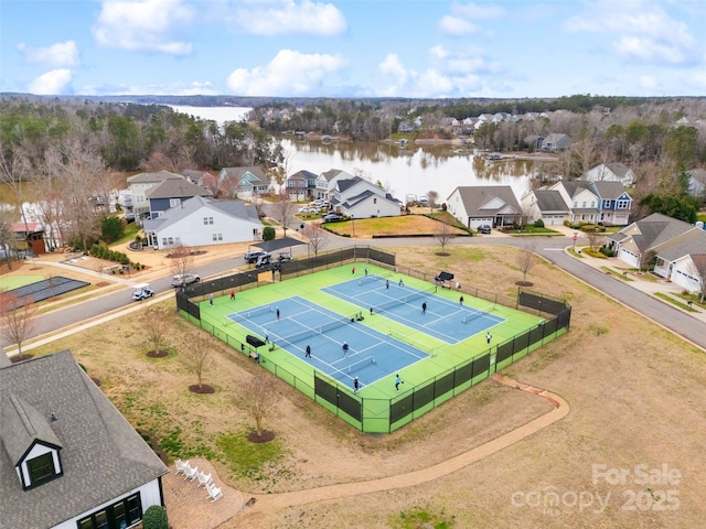 drone / aerial view with a water view and a residential view