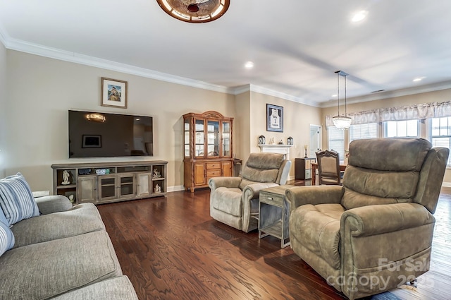 living area with baseboards, recessed lighting, dark wood finished floors, and crown molding