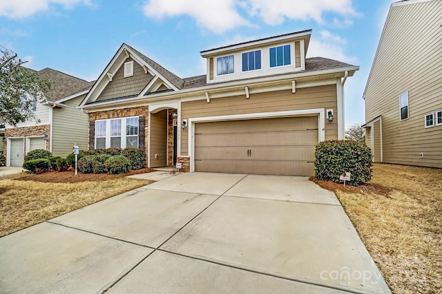 craftsman-style home featuring stone siding and concrete driveway