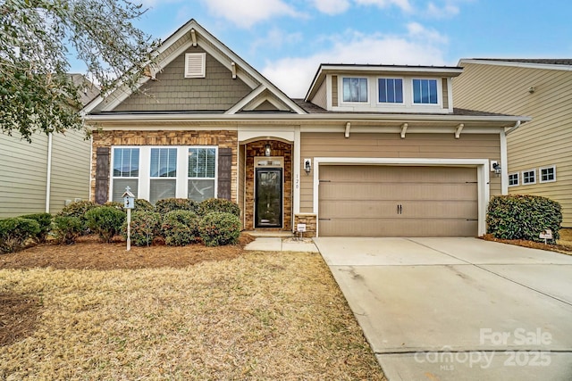 craftsman house with concrete driveway