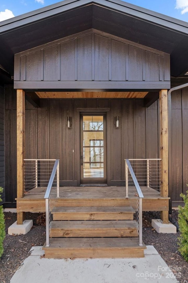 entrance to property featuring board and batten siding