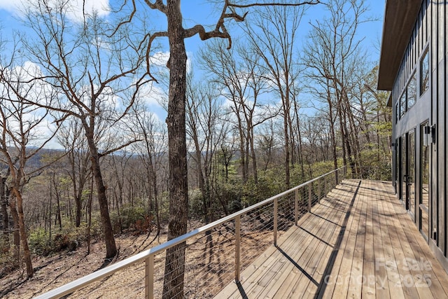 deck featuring a forest view