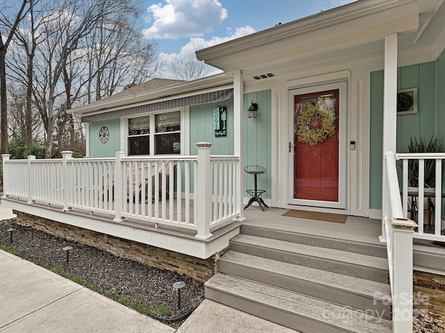 doorway to property with a porch