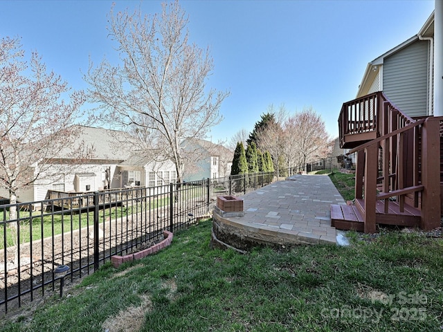 view of yard with a patio, stairway, a fenced backyard, and a wooden deck