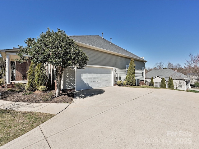 view of front of property with a garage and driveway