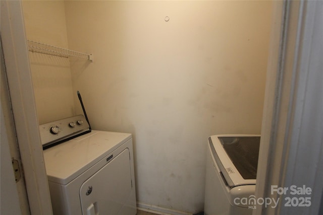 clothes washing area with laundry area and washing machine and clothes dryer