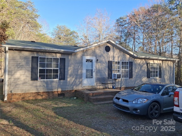 view of front of house with crawl space