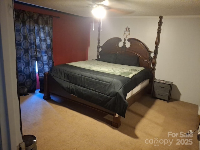 bedroom featuring carpet flooring, a ceiling fan, and crown molding