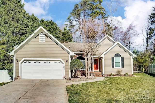 ranch-style home featuring a front yard, concrete driveway, an attached garage, and fence