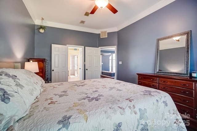 bedroom with visible vents, ornamental molding, and a ceiling fan