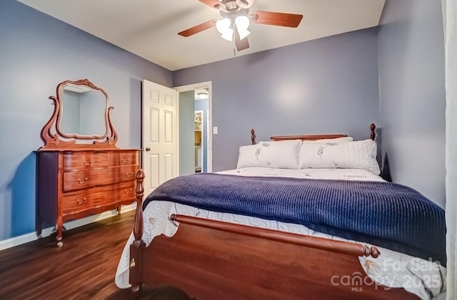 bedroom with dark wood finished floors, baseboards, and ceiling fan