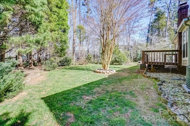 view of yard with a wooden deck