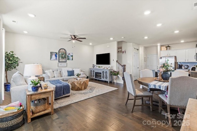 living area with ceiling fan, dark wood-type flooring, visible vents, and recessed lighting