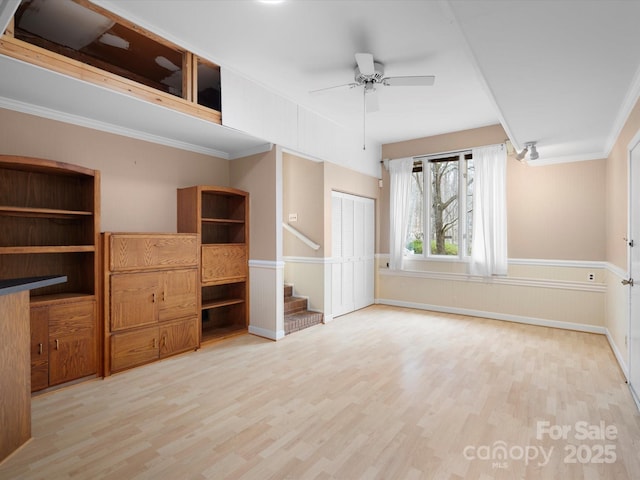 unfurnished bedroom featuring a closet, wood finished floors, and ornamental molding