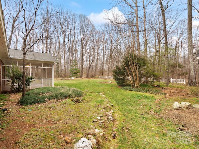 view of yard featuring a sunroom