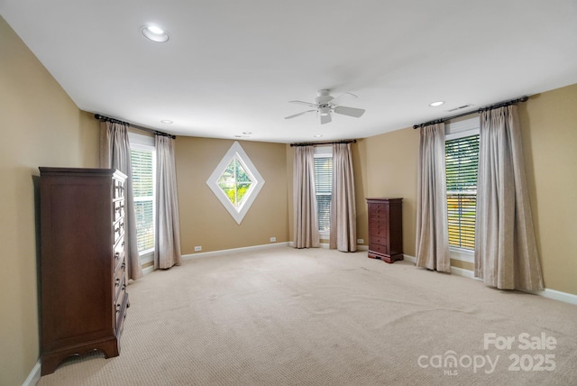 unfurnished living room with visible vents, baseboards, ceiling fan, carpet, and recessed lighting