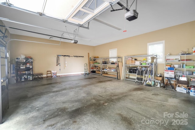 garage featuring a workshop area and a garage door opener