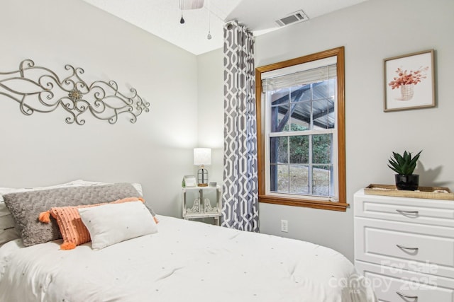 bedroom featuring visible vents