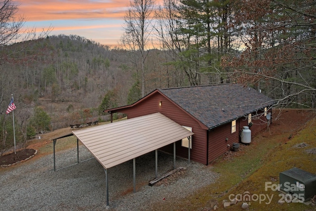 exterior space featuring a forest view