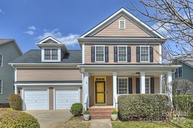 traditional-style home featuring a porch, concrete driveway, a shingled roof, and an attached garage