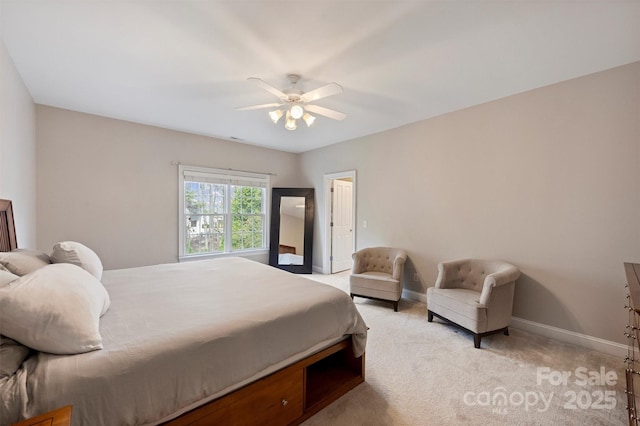bedroom featuring a ceiling fan, light carpet, and baseboards