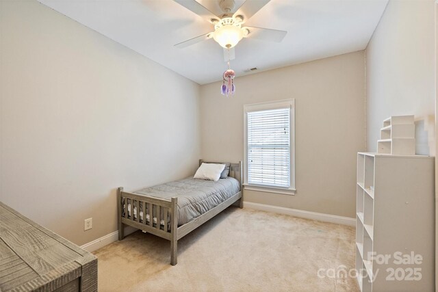 bedroom featuring carpet, baseboards, and ceiling fan