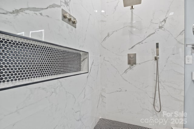 room details with a marble finish shower