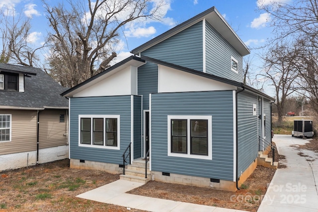 back of house with entry steps, central AC unit, and crawl space