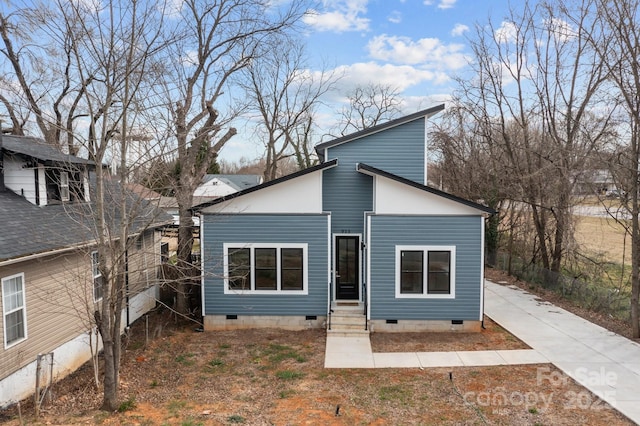 back of house featuring crawl space