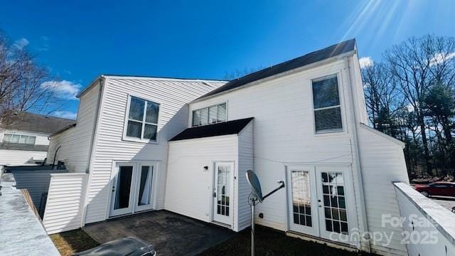 back of house featuring a patio area, fence, and french doors