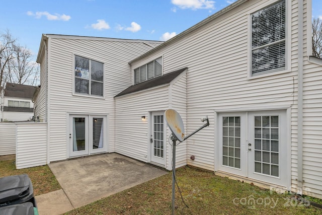 rear view of property with french doors and a patio