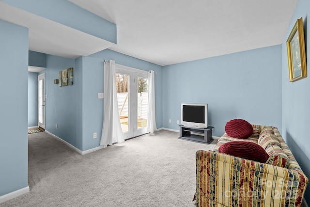 living room with carpet floors and baseboards