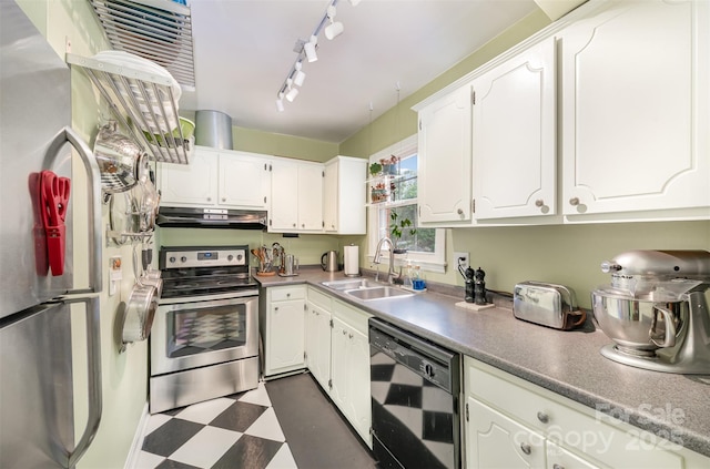 kitchen featuring dark floors, stainless steel appliances, white cabinets, a sink, and under cabinet range hood