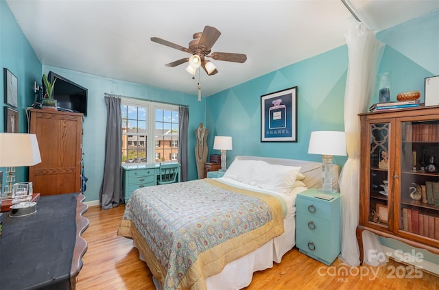 bedroom with ceiling fan and wood finished floors