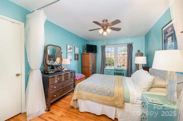 bedroom with a ceiling fan and wood finished floors