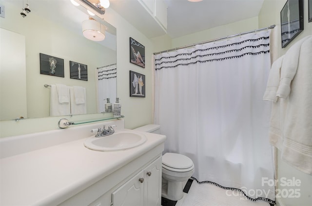 full bathroom with tile patterned flooring, a shower with shower curtain, vanity, and toilet