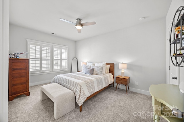 carpeted bedroom featuring visible vents, ceiling fan, and baseboards