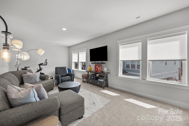 carpeted living room featuring recessed lighting, visible vents, and baseboards