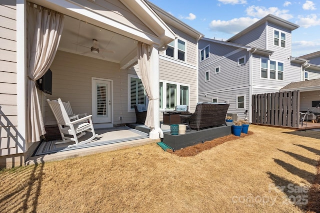 back of property with a patio and ceiling fan